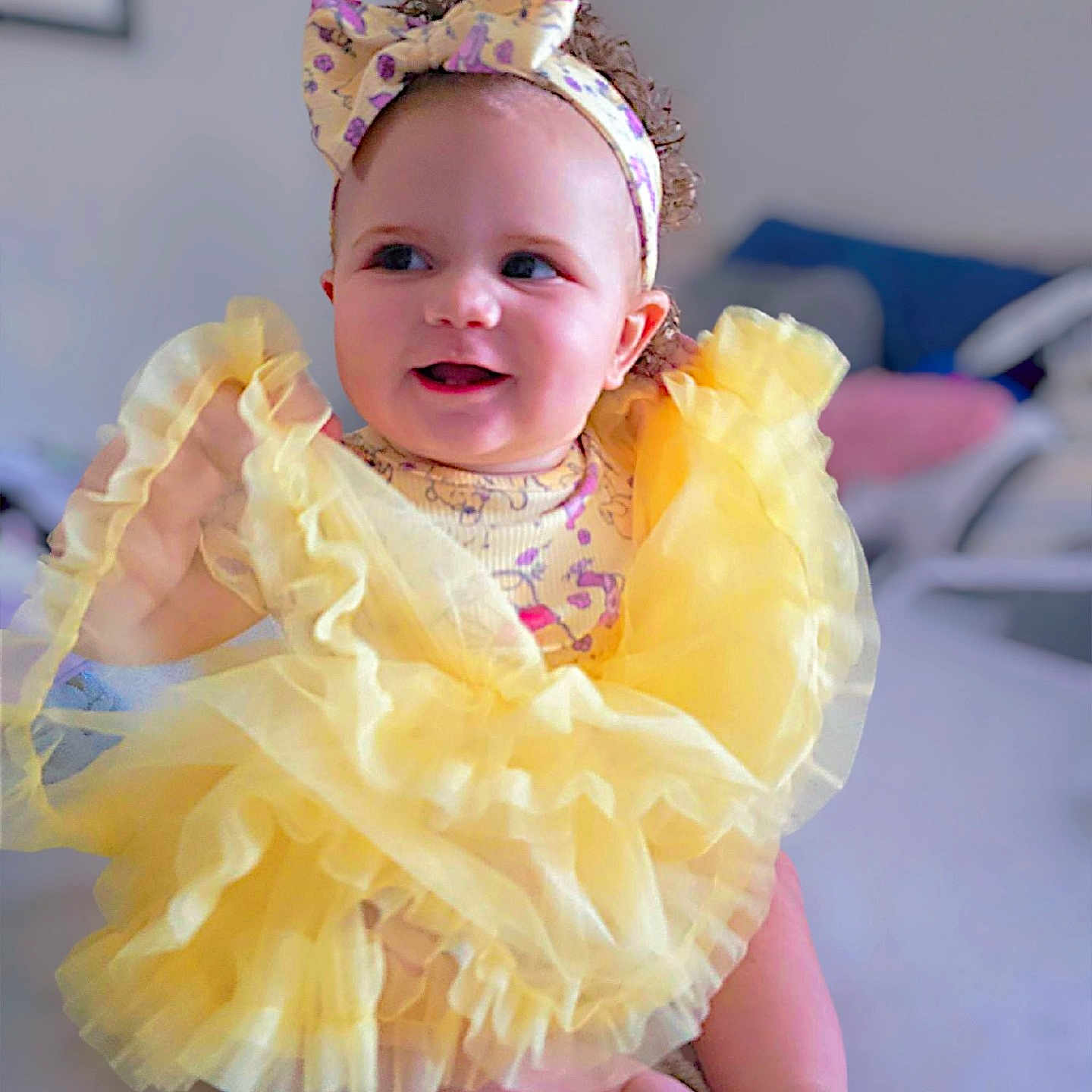 Emersyn is registered to the contest to win money with this photo: accessories, baby, bodypart, bonnet, clothing, costume, dress, face, finger, flower, formalwear, hand, hat, head, headband, jewelry, person, photography, plant, portrait