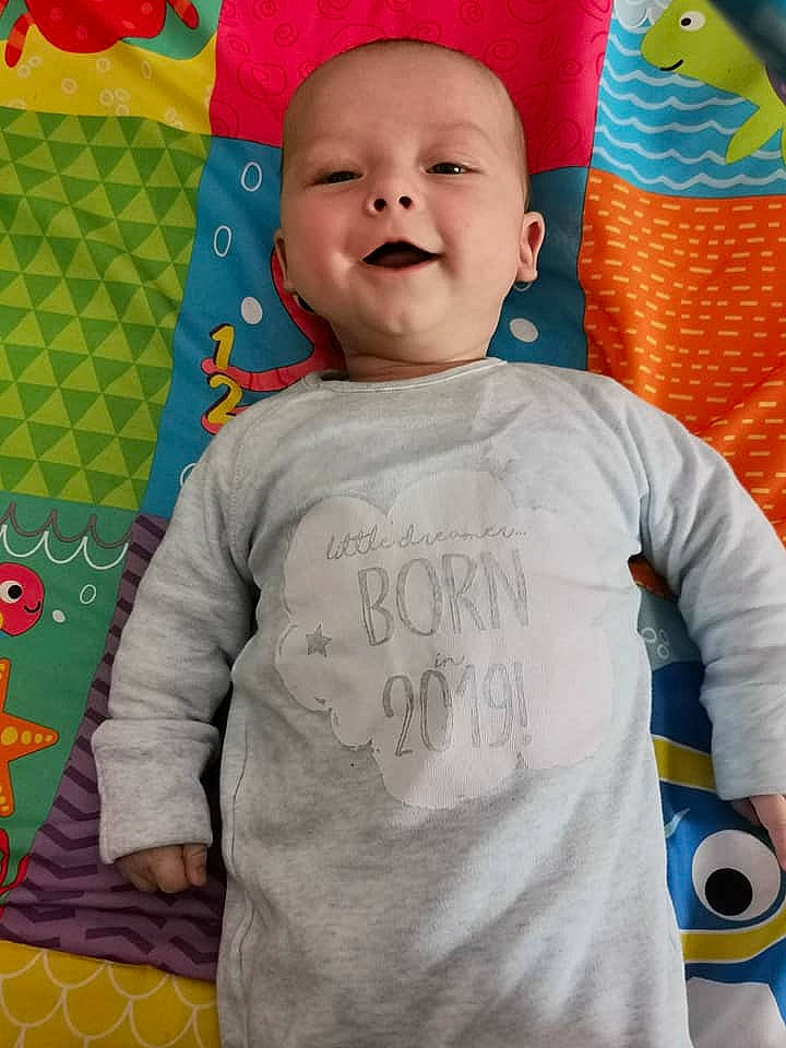 Daniel is registered to the contest to win money with this photo: baby, baby_products, child, linens, person, play, product, sleeve, smile, textile, toddler