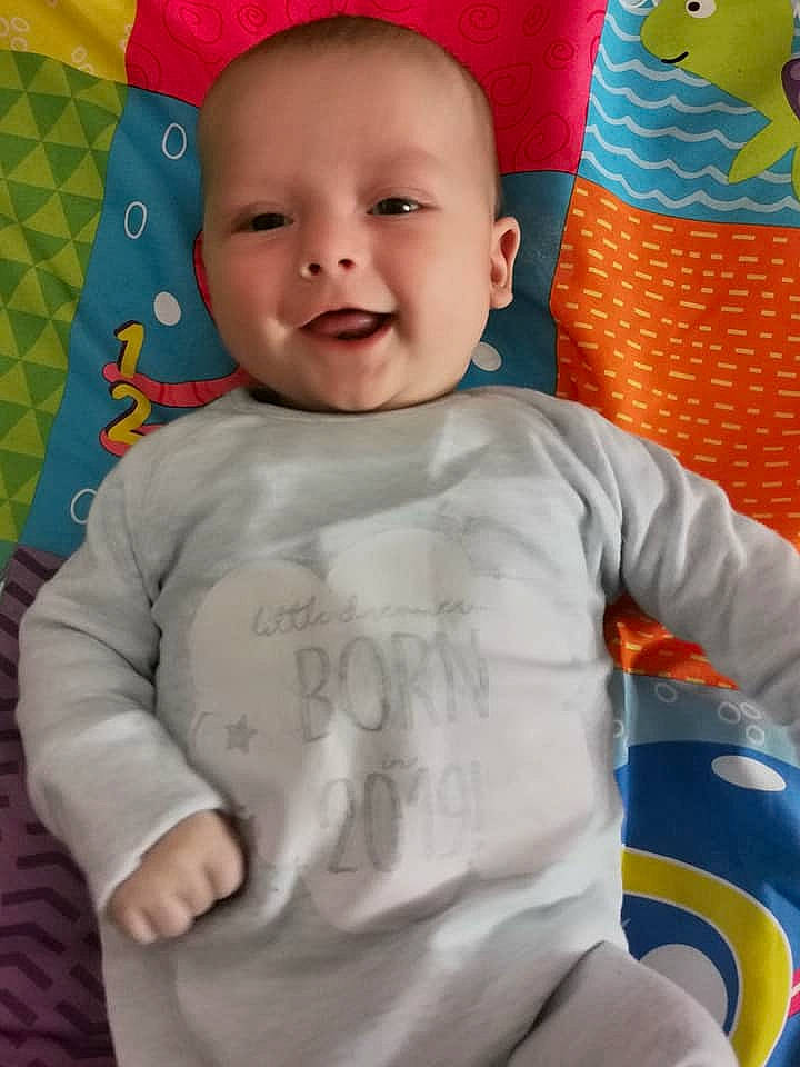 Daniel is registered to the contest to win money with this photo: baby, baby_products, baby_toddler_clothing, cheek, child, face, nose, person, play, skin, sleeve, smile, toddler