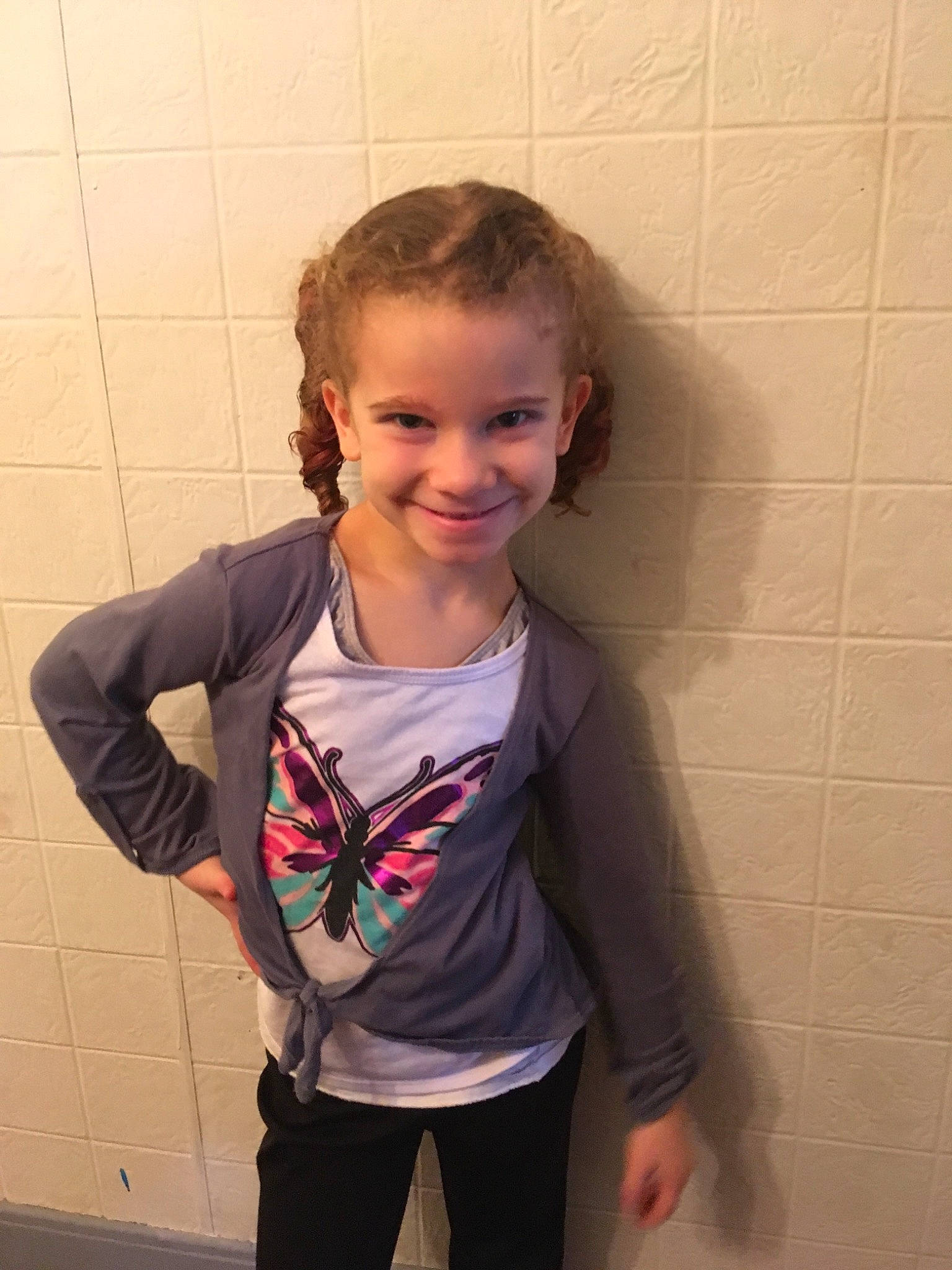 Katelyn joined the competition — help win amazing prizes! child, face, fun, joy, neck, outerwear, person, room, shoulder, smile, standing, t_shirt, toddler