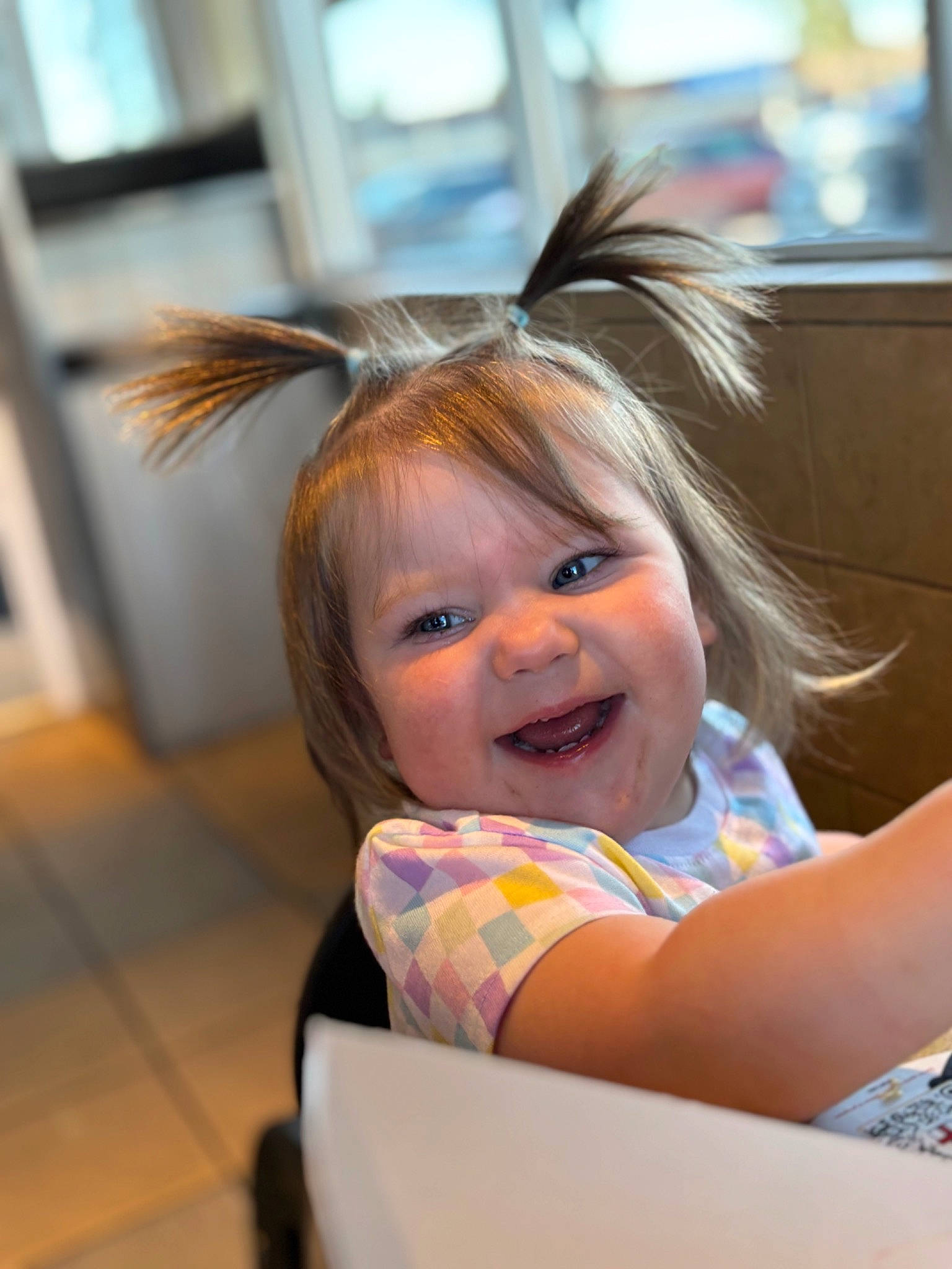 Alaska is registered to the contest to win money with this photo: bangs, blond, child, event, eye, eyelash, face, facial_expression, fashion_accessory, fun, happy, headpiece, iris, joy, laugh, person, recreation, room, sitting, skin