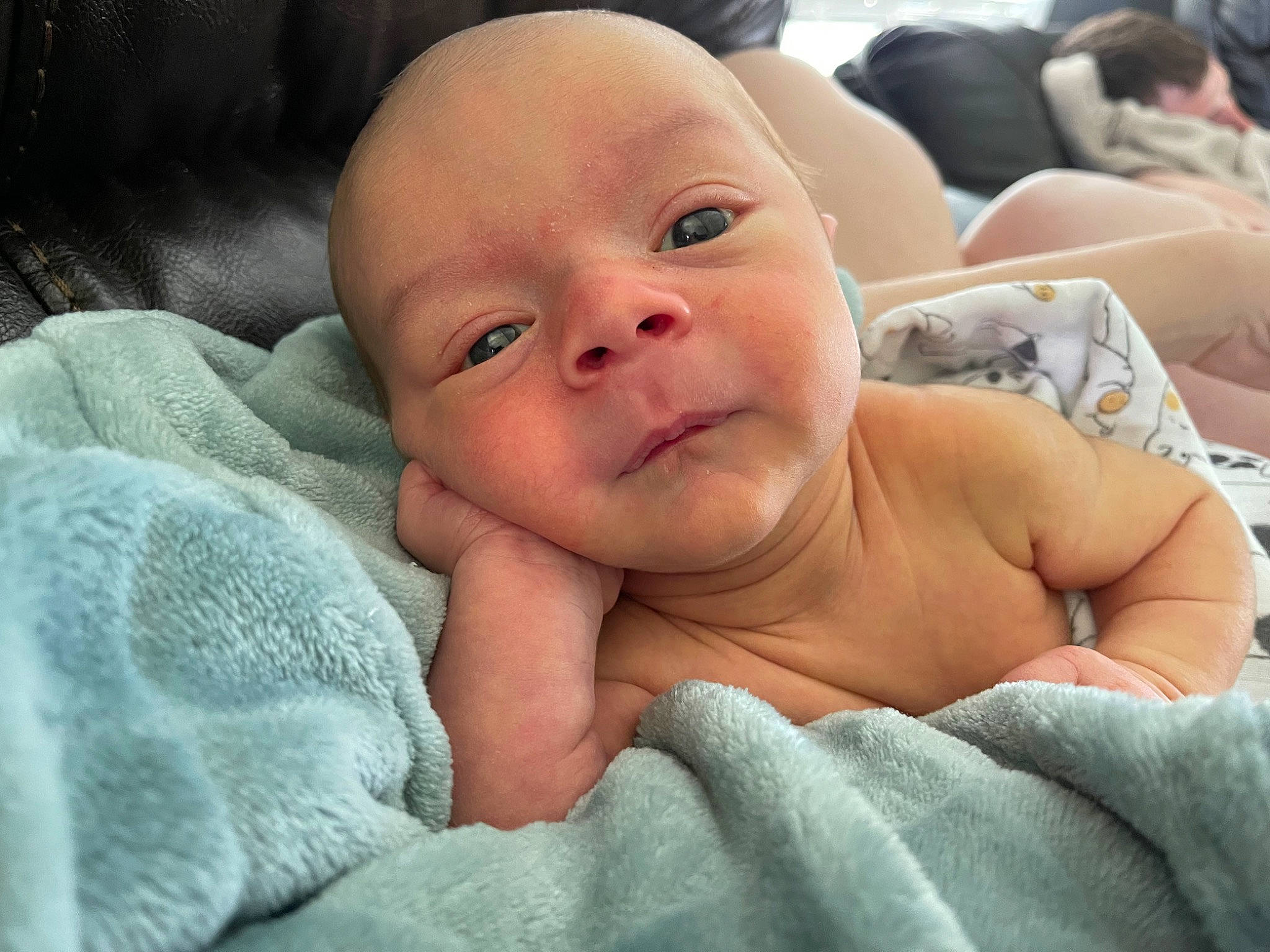 Zedric is registered to the contest to win money with this photo: abdomen, baby, barechested, cheek, chest, child, comfort, event, eye, happy, hat, head, linens, mouth, nose, person, skin, smile, thumb, toddler