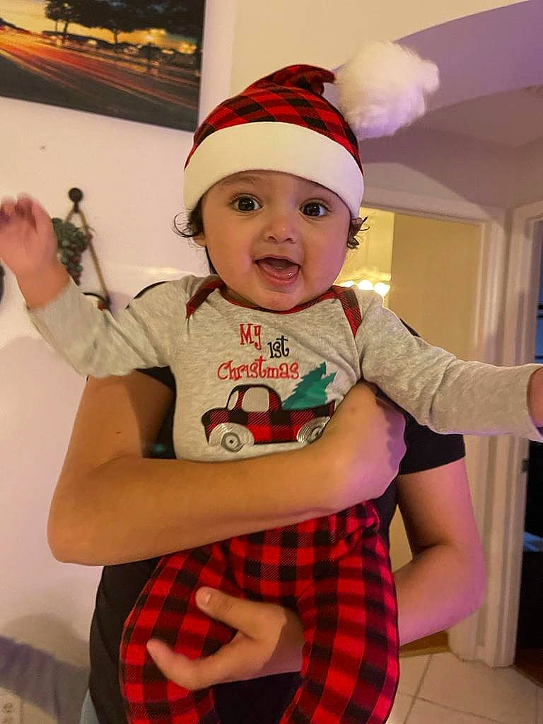 Gabriel joined the competition — help win amazing prizes! baby, baby_toddler_clothing, cap, costume_hat, event, fun, happy, hat, headwear, holiday, pattern, person, pink, plaid, red, shorts, sleeve, smile, t_shirt, tartan