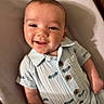 baby, infant, smiling, happy, child, portrait, indoor, clothing, buttoned_shirt, light_blue, seated, face, skin, head, person, young_child, cute, expression, comfort, furniture