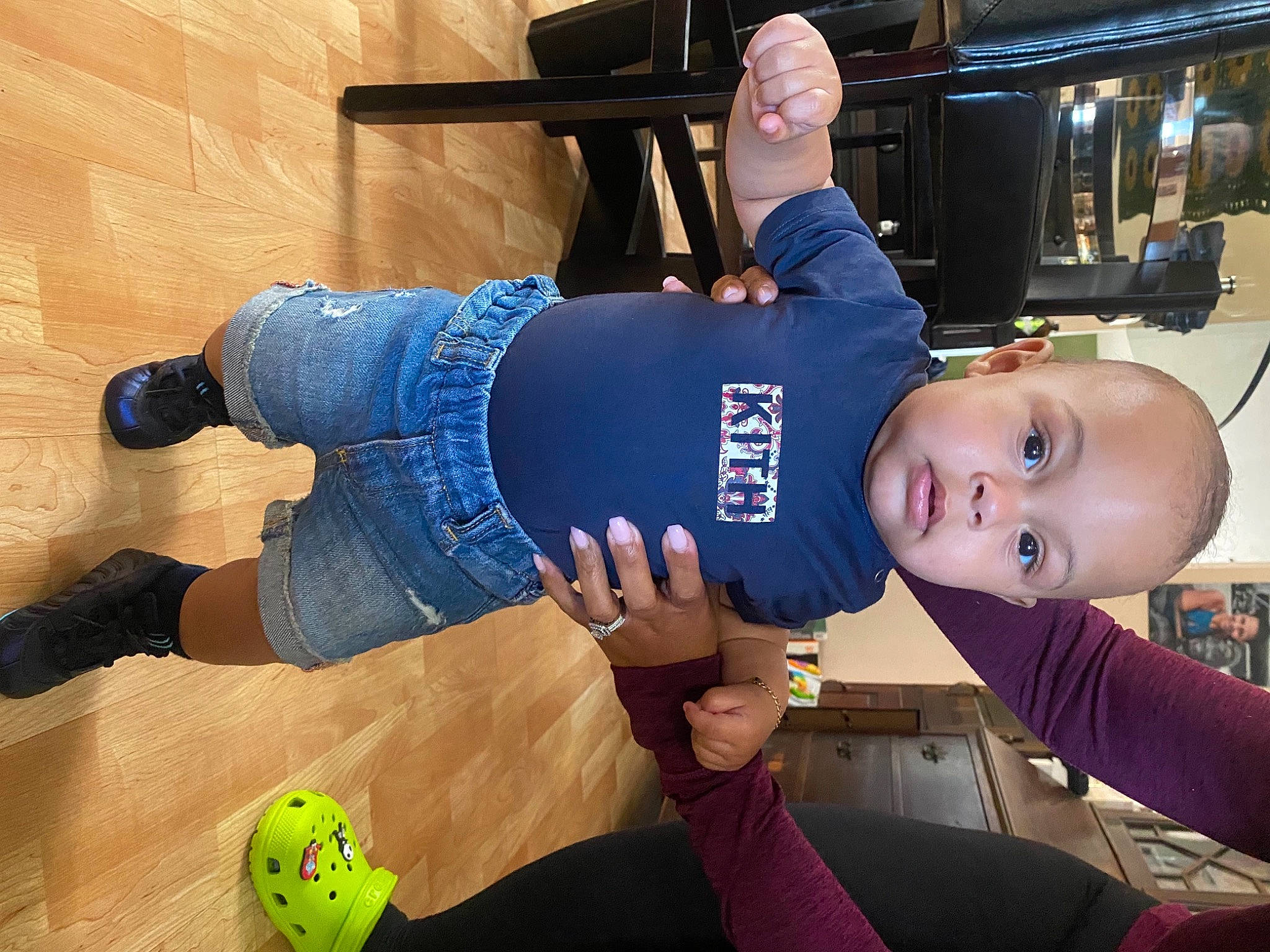 Kashmir is registered to the contest to win money with this photo: baby, ball, blurred, elbow, electric_blue, flooring, football, fun, hat, human_leg, joy, knee, leisure, person, sitting, smile, sock, sports_equipment, sportswear, t_shirt