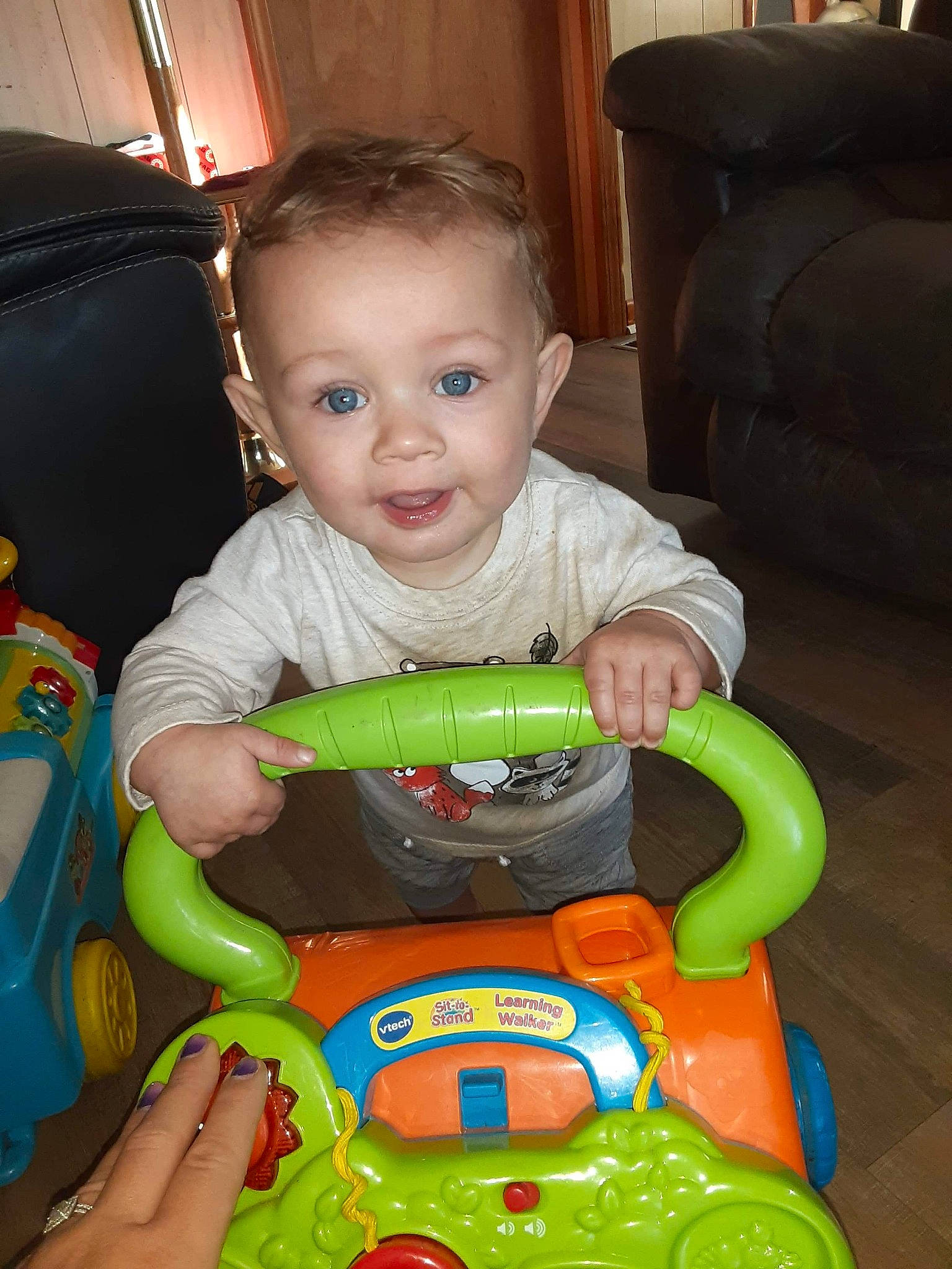 Emmett is registered to the contest to win money with this photo: baby, baby_playing_with_toys, baby_toddler_clothing, cheek, child, couch, face, facial_expression, fun, head, iris, mouth, person, picture_frame, product, riding_toy, sitting, skin, snapshot, toddler