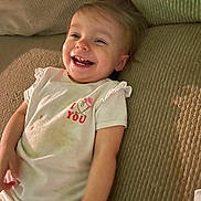 Caroline joined the competition — help win amazing prizes! toddler, child, smiling, happy, couch, clothing, white_shirt, stain, indoor, face, person, baby, infant, joy, relaxing, home, furniture, cute, portrait, casual