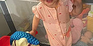 Caroline joined the competition — help win amazing prizes! toddler, child, pink_headband, bunny_ears, onesie, rocking_horse, toy, playpen, smiling, waving, indoor, floor, wood_floor, pink_toy, piggy_bank, happy, cute, young_child, baby, playtime