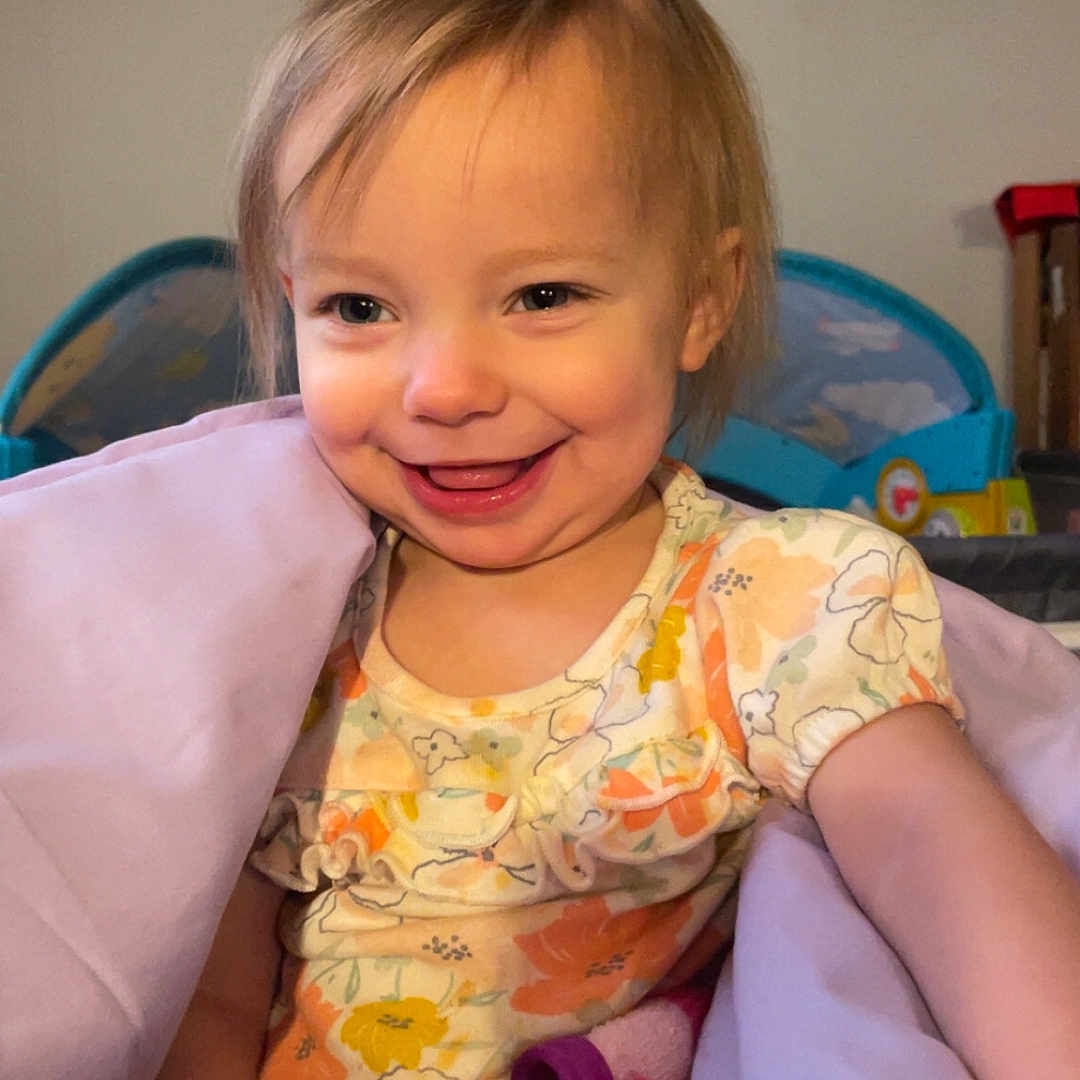 Caroline Cottrill joined the competition — help win amazing prizes! architecture, baby, bodypart, clothing, couch, cushion, dress, face, finger, furniture, hand, happy, head, homedecor, person, photography, portrait, sitting, smile, t_shirt