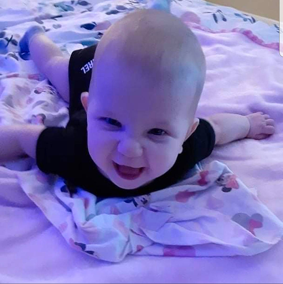 Liberty is registered to the contest to win money with this photo: baby, baby_carriage, baby_laughing, baby_products, baby_toddler_clothing, cheek, child, comfort, cool, fun, happy, magenta, mouth, person, pink, purple, sitting, skin, smile, toddler