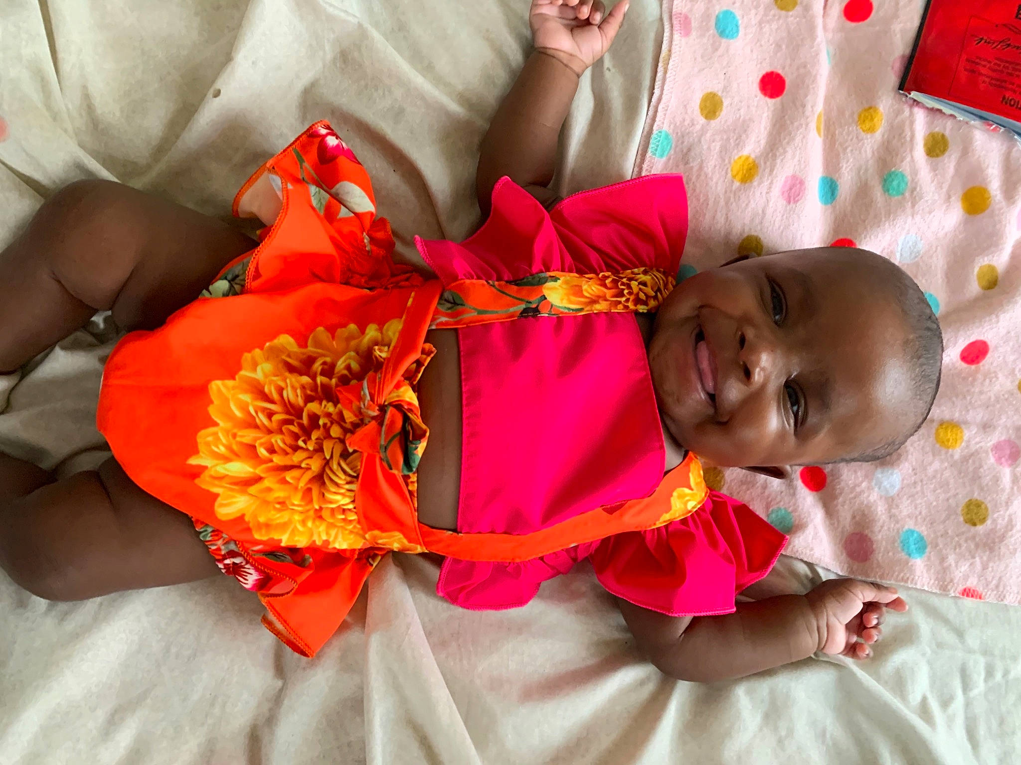 Kaiya joined the competition — help win amazing prizes! baby, baby_toddler_clothing, child, dress, event, fashion_accessory, fun, happy, joy, linens, magenta, orange, pattern, peach, person, petal, pink, red, toddler, tradition