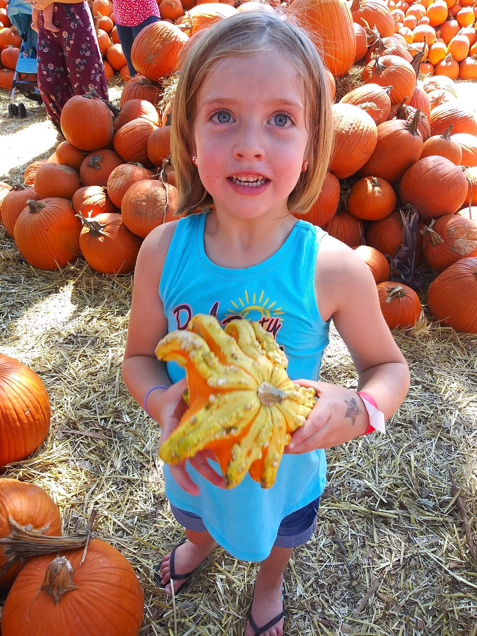 Peyton joined the competition — help win amazing prizes! baby_toddler_clothing, calabaza, cucurbita, facial_expression, fruit, gourd, happy, head, local_food, natural_foods, orange, people, person, photograph, plant, pumpkin, smile, squash, vegetable, whole_food