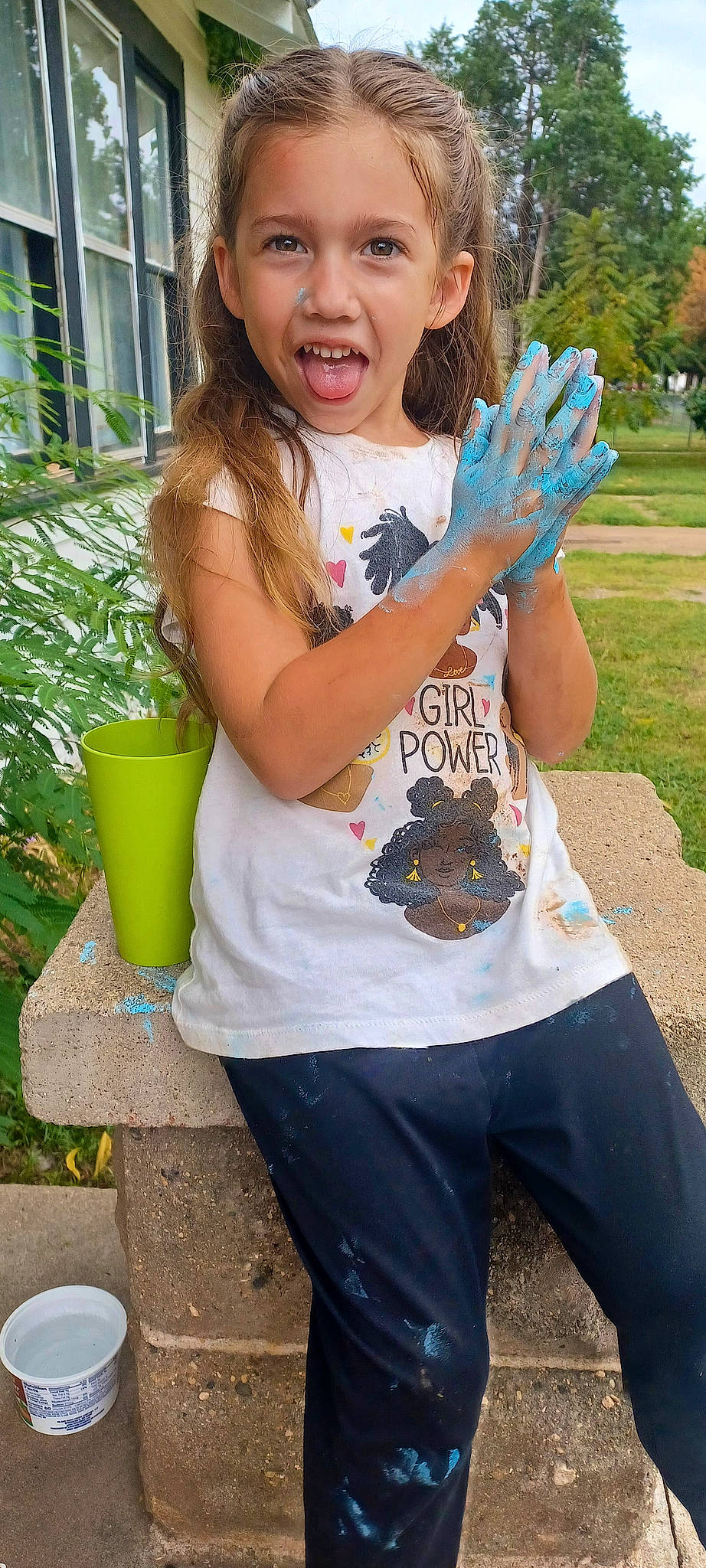 Penelope is registered to the contest to win money with this photo: bucket, child, denim, electric_blue, fun, gesture, grass, happy, leisure, neck, pattern, people_in_nature, person, plant, play, recreation, sleeve, soil, t_shirt, toddler