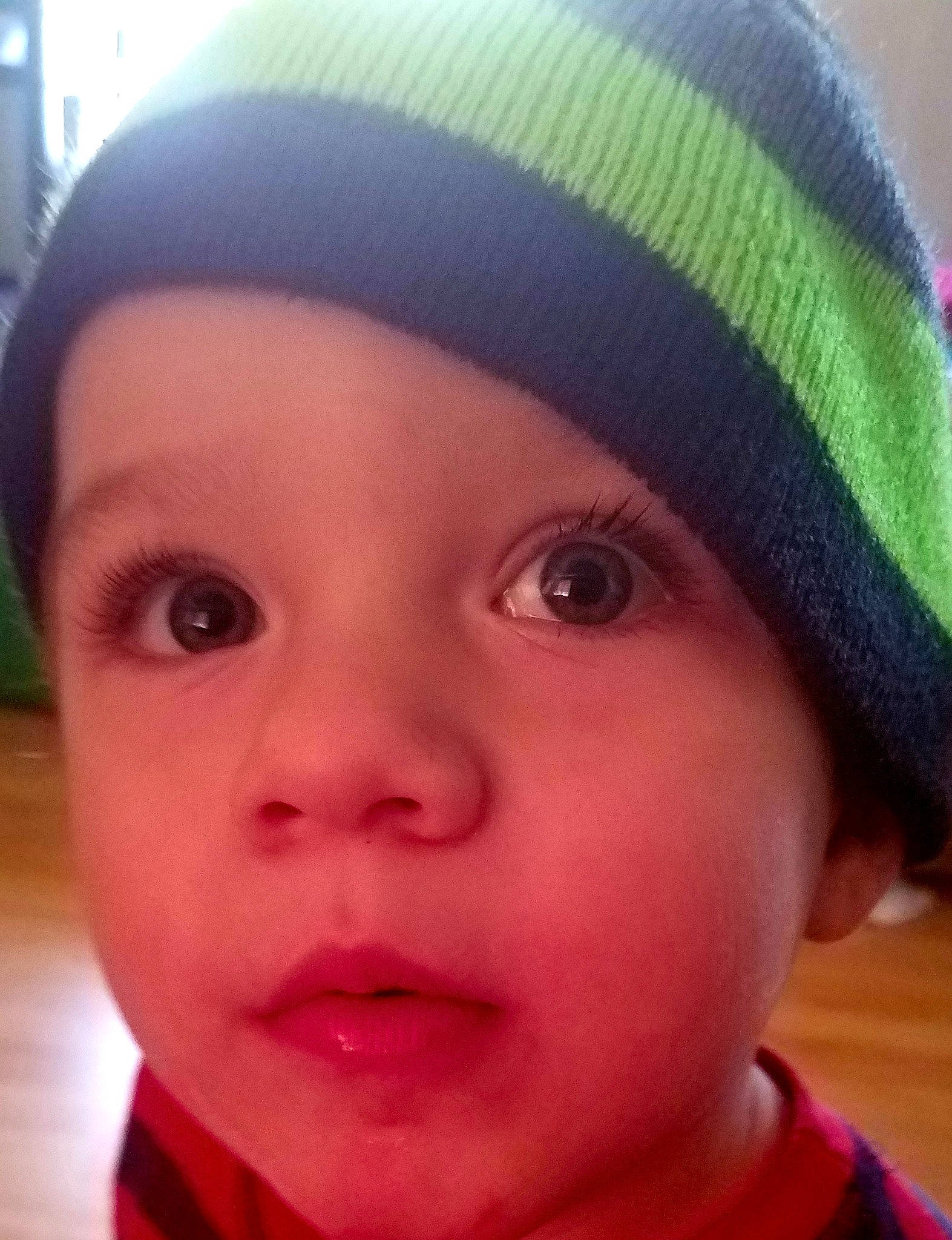 Luke is registered to the contest to win money with this photo: baby, beanie, cap, cheek, child, chin, close_up, cool, eye, eyebrow, face, forehead, head, headgear, knit_cap, lip, nose, person, selfie, skin