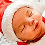 baby, sleeping, santa_hat, christmas, festive, holiday, cozy, soft_blanket, infant, face, closed_eyes, cute, red_clothing, white_fur, portrait, peaceful, newborn, child, warm, relaxation