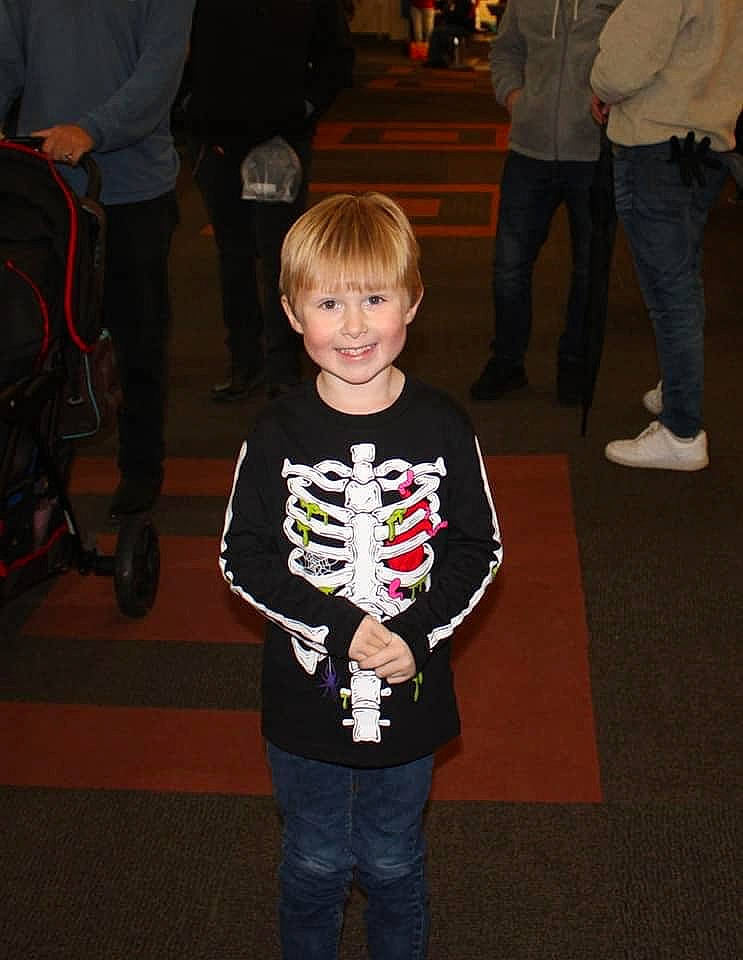 Jaxton is registered to the contest to win money with this photo: backpack, bag, carpet, child, clothing, costume, event, flooring, fun, holiday, jeans, joy, leg, luggage_and_bags, person, recreation, shoe, sleeve, smile, standing