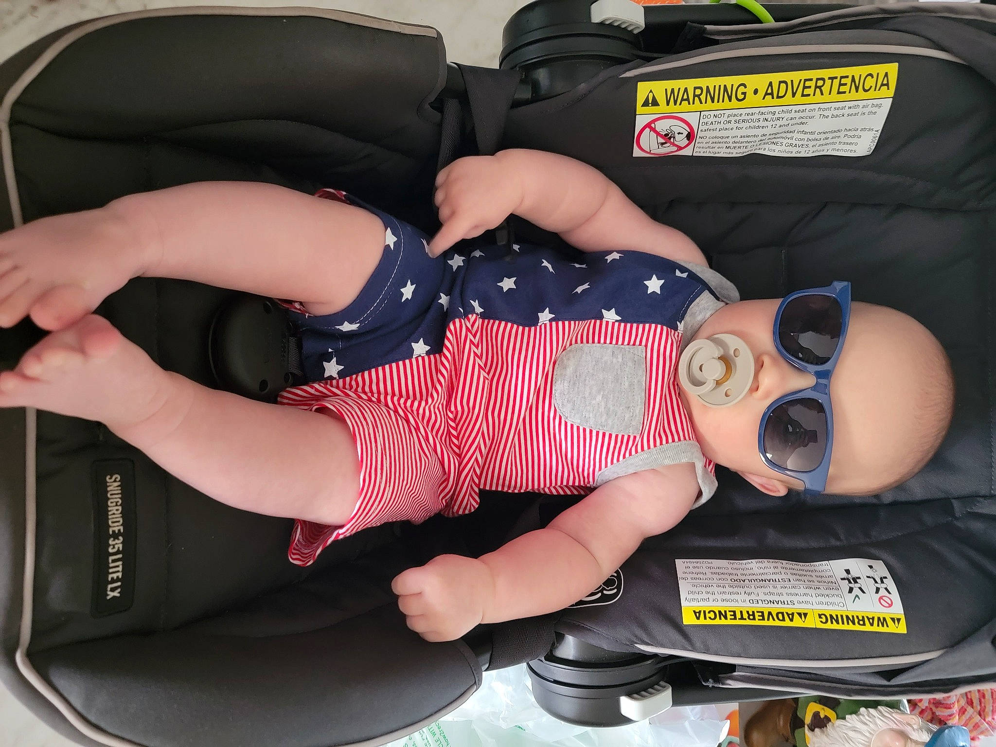 Eason is registered to the contest to win money with this photo: auto_part, automotive_design, baby, baby_carriage, baby_products, baby_toddler_clothing, bag, bumper, car_seat, comfort, goggles, human_leg, knee, lap, luggage_and_bags, motor_vehicle, person, thigh, toddler, vehicle