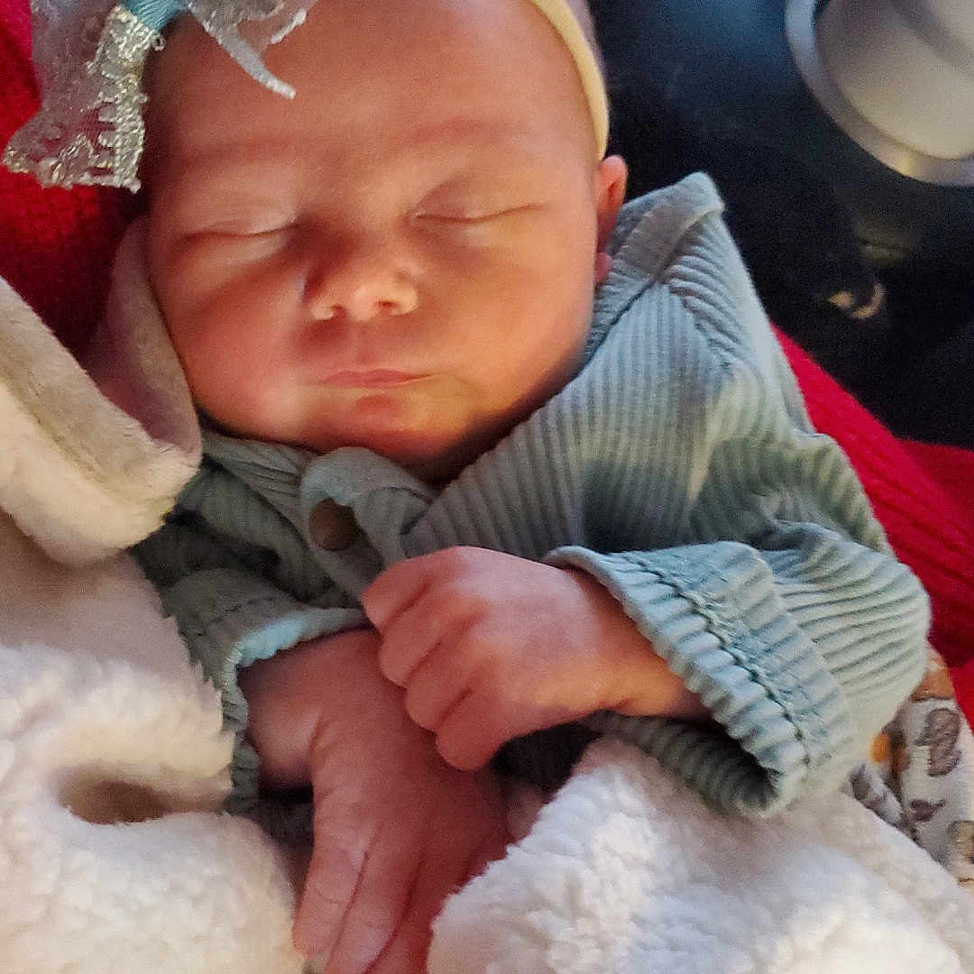 Josephine joined the competition — help win amazing prizes! baby, blanket, bodypart, bonnet, clothing, couch, cushion, face, finger, glove, hand, hat, head, homedecor, newborn, person, photography, portrait, quilt, sleeping