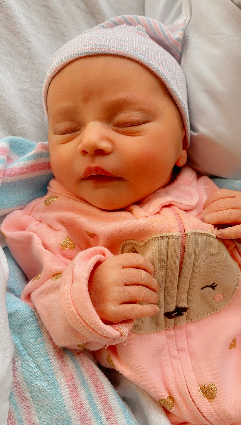 Sophia joined the competition — help win amazing prizes! baby, baby_sleeping, baby_toddler_clothing, cheek, child, chin, comfort, face, facial_expression, finger, gesture, headwear, lip, mouth, nose, person, pink, skin, sleeve, textile