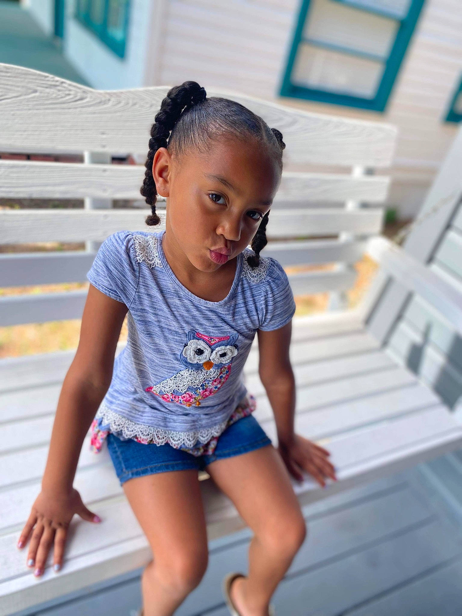 Kinsleigh is registered to the contest to win money with this photo: baby_toddler_clothing, barefoot, black_hair, blue, electric_blue, fashion_design, flash_photography, happy, human_leg, joint, knee, leg, leisure, person, shorts, sitting, sleeve, sportswear, t_shirt, thigh