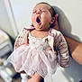 Aurora joined the competition — help win amazing prizes! baby, yawning, pink_dress, tutu, infant, cute, sleepy, human, person, tattoo, hand, skin, clothing, indoor, soft_light, portrait, newborn, adorable, holding, closeup