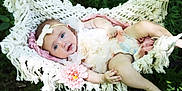 Nova is registered to the contest to win money with this photo: baby, infant, hammock, macrame, flower, headband, bow, dress, outdoor, greenery, nature, baby_girl, skin, cute, relaxing, summer, child, portrait, soft_lighting, peaceful