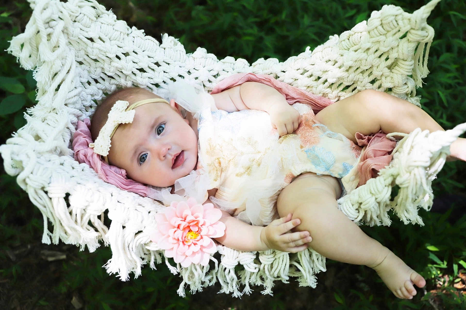 Nova is registered to the contest to win money with this photo: baby, infant, hammock, macrame, flower, headband, bow, dress, outdoor, greenery, nature, baby_girl, skin, cute, relaxing, summer, child, portrait, soft_lighting, peaceful