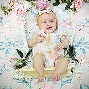 Nova joined the competition — help win amazing prizes! baby, infant, smile, flower, swing, headband, pastel, floral_pattern, cute, child, portrait, decor, greenery, soft_lighting, happy, indoors, person, small_child, playful, seated