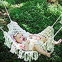 Nova is registered to the contest to win money with this photo: baby, hammock, flower, outdoor, forest, greenery, smiling, child, nature, sunlight, grass, cute, headband, relaxing, happy, infant, summer, peaceful, portrait, feet