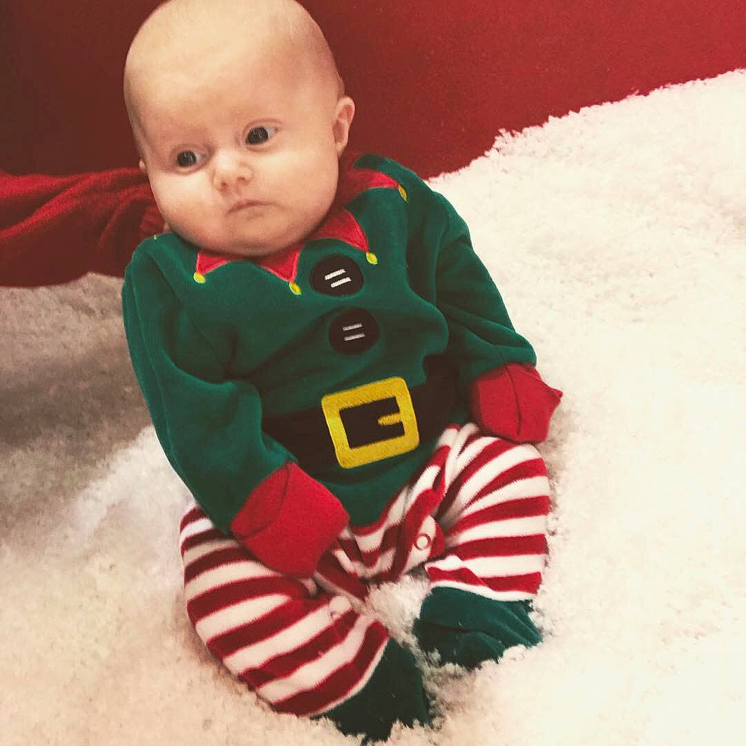 Eliza-grace is registered to the contest to win money with this photo: baby, child, christmas, fictional_character, head, holiday, outerwear, person, play, sitting, sleeve, smile, t_shirt, toddler