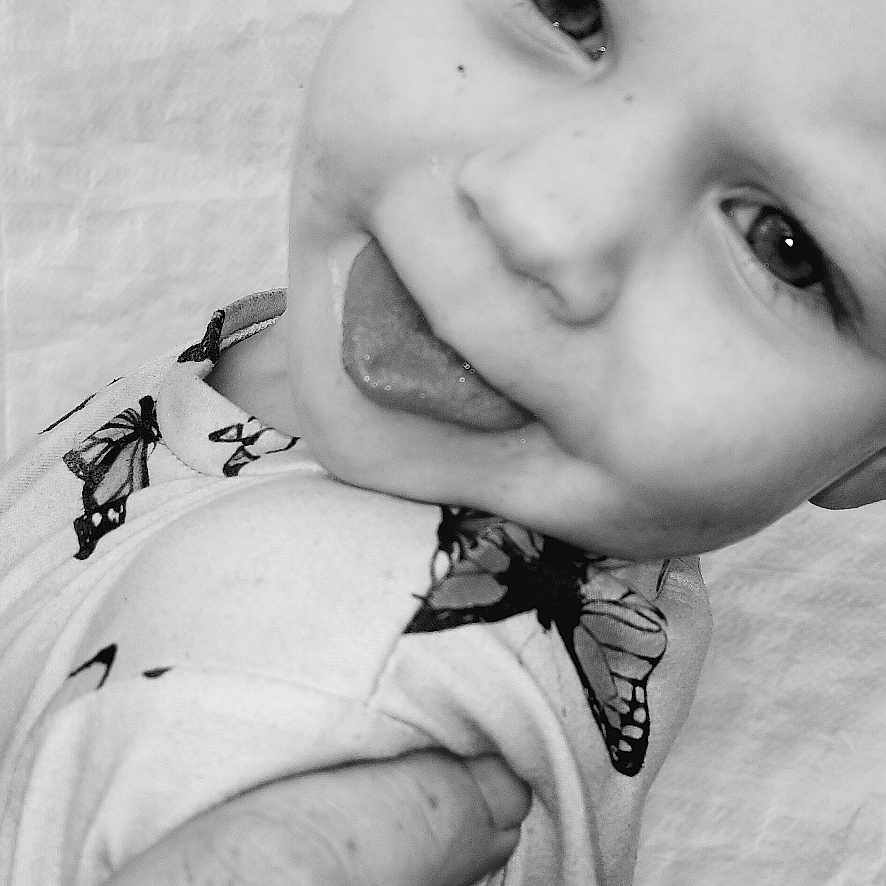 Paislee is registered to the contest to win money with this photo: accessories, animal, baby, bodypart, face, finger, hand, happy, head, invertebrate, mouth, newborn, person, photography, portrait, skin, smile, spider, tattoo, wrist