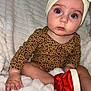 Gracie joined the competition — help win amazing prizes! baby, infant, headwrap, leopard_print, red_shoe, blanket, fluffy, cute, child, portrait, sitting, hand, footwear, indoor, soft_texture, curious, closeup, person, apparel, light_skin