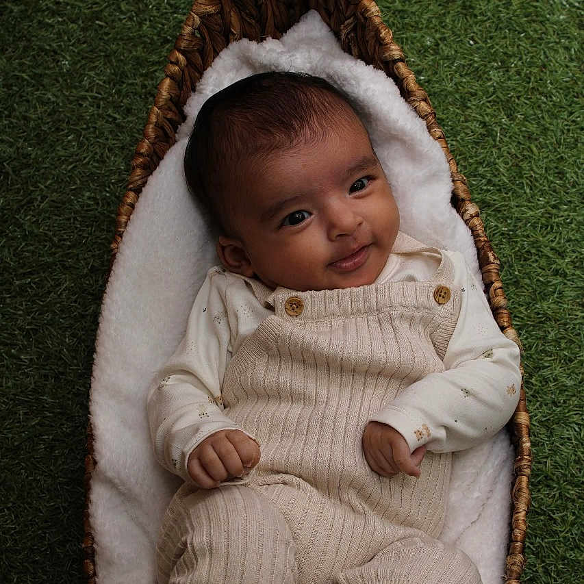 Heverett is registered to the contest to win money with this photo: baby, bed, blanket, clothing, cradle, crib, face, footwear, furniture, hat, head, infantbed, knitwear, newborn, pants, person, photography, portrait, shoe, sweater