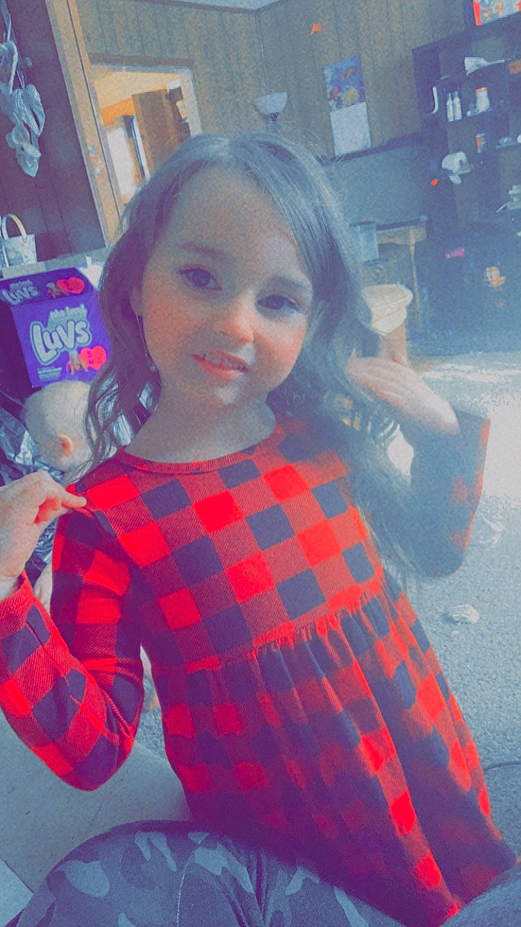 Makala is registered to the contest to win money with this photo: black_hair, cool, dress, facial_expression, fashion_design, fun, hair, happy, head, human, lip, person, pink, plaid, purple, shoulder, skin, sleeve, standing, street_fashion
