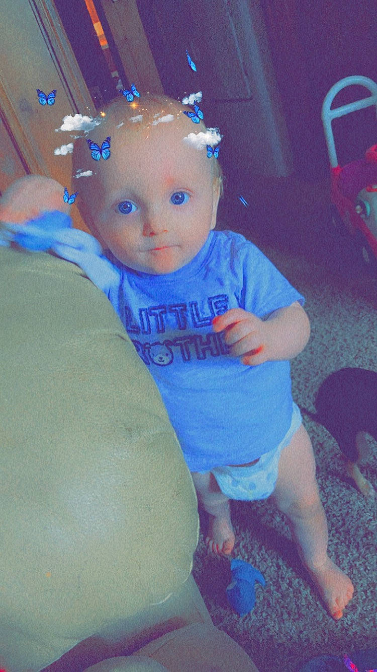 Luke is registered to the contest to win money with this photo: azure, baby_toddler_clothing, blue, chair, child, cool, electric_blue, fun, happy, human_leg, leg, leisure, magenta, party_supply, person, pink, skin, t_shirt, thigh, toddler