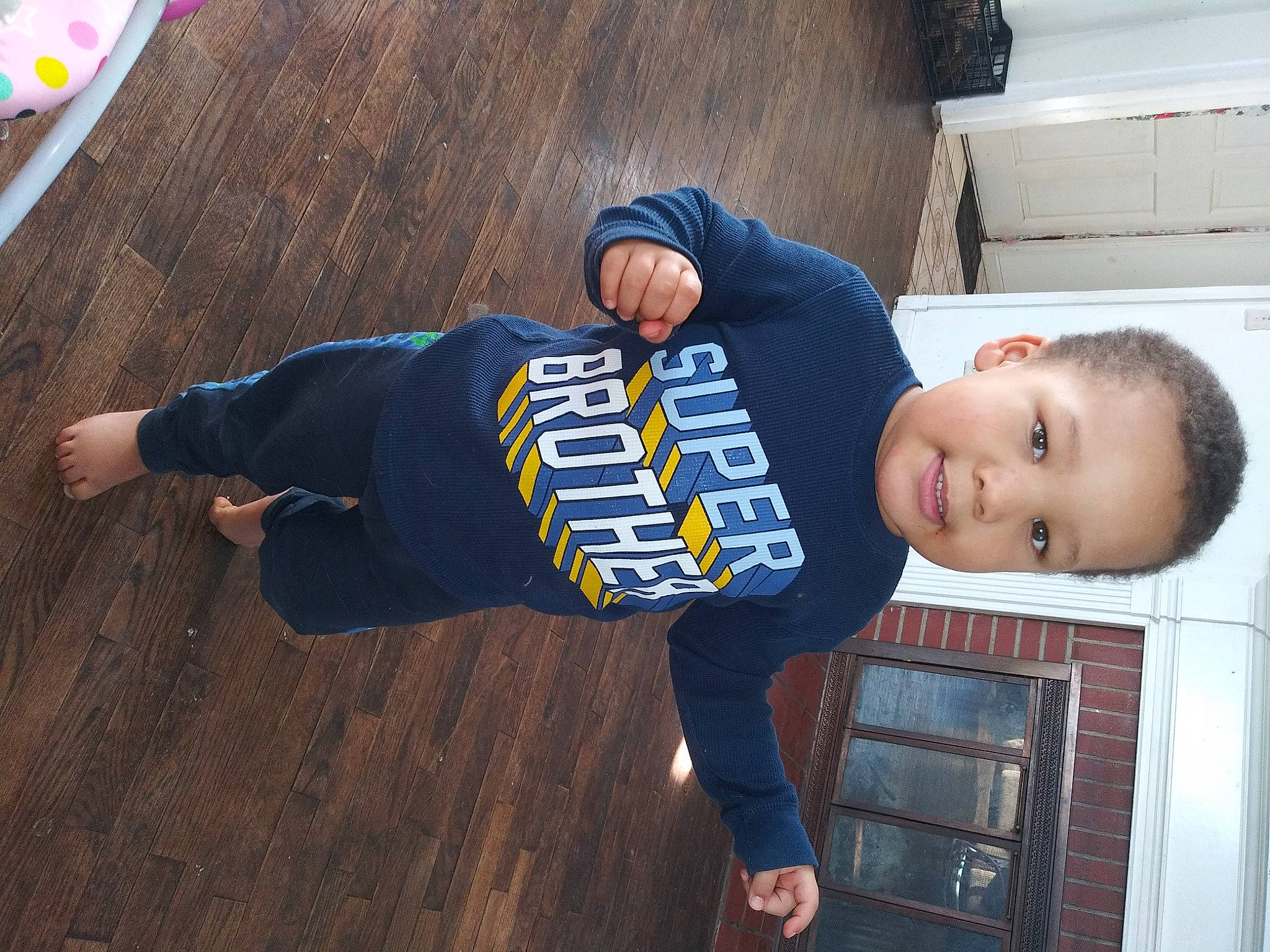 Anakin joined the competition — help win amazing prizes! baby_toddler_clothing, cap, child, denim, electric_blue, floor, flooring, fun, happy, hardwood, hat, person, sitting, sleeve, smile, sportswear, street_fashion, t_shirt, thigh, toddler