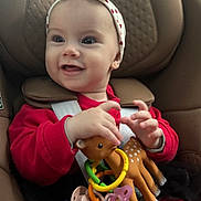 Malilou participe au concours pour gagner de l'argent avec cette photo : baby, car_seat, child, close_up, comfort, cute, face, hands, happy, headband, indoor, infant, pacifier, playful, polka_dot, polka_dots, red_clothing, seat_belt, smiling, toy