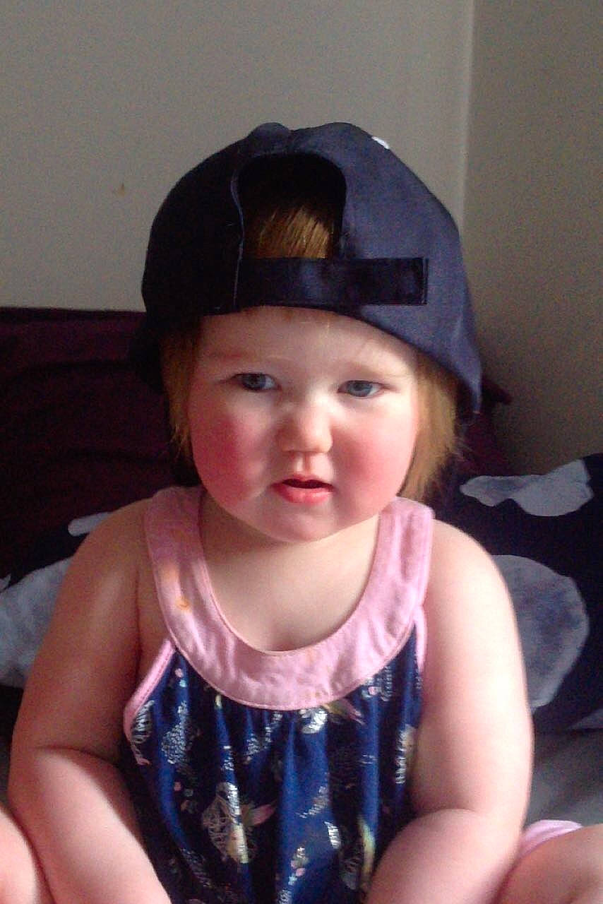 Amelia is registered to the contest to win money with this photo: black_hair, cap, child, fashion_accessory, hair_accessory, hat, headgear, person, toddler