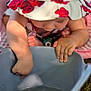 toddler, child, baby, hat, floral_pattern, sunhat, water, bucket, hand, foot, outdoor, curious, skin, playing, summer, closeup, exploring, sunlight, nature, candid