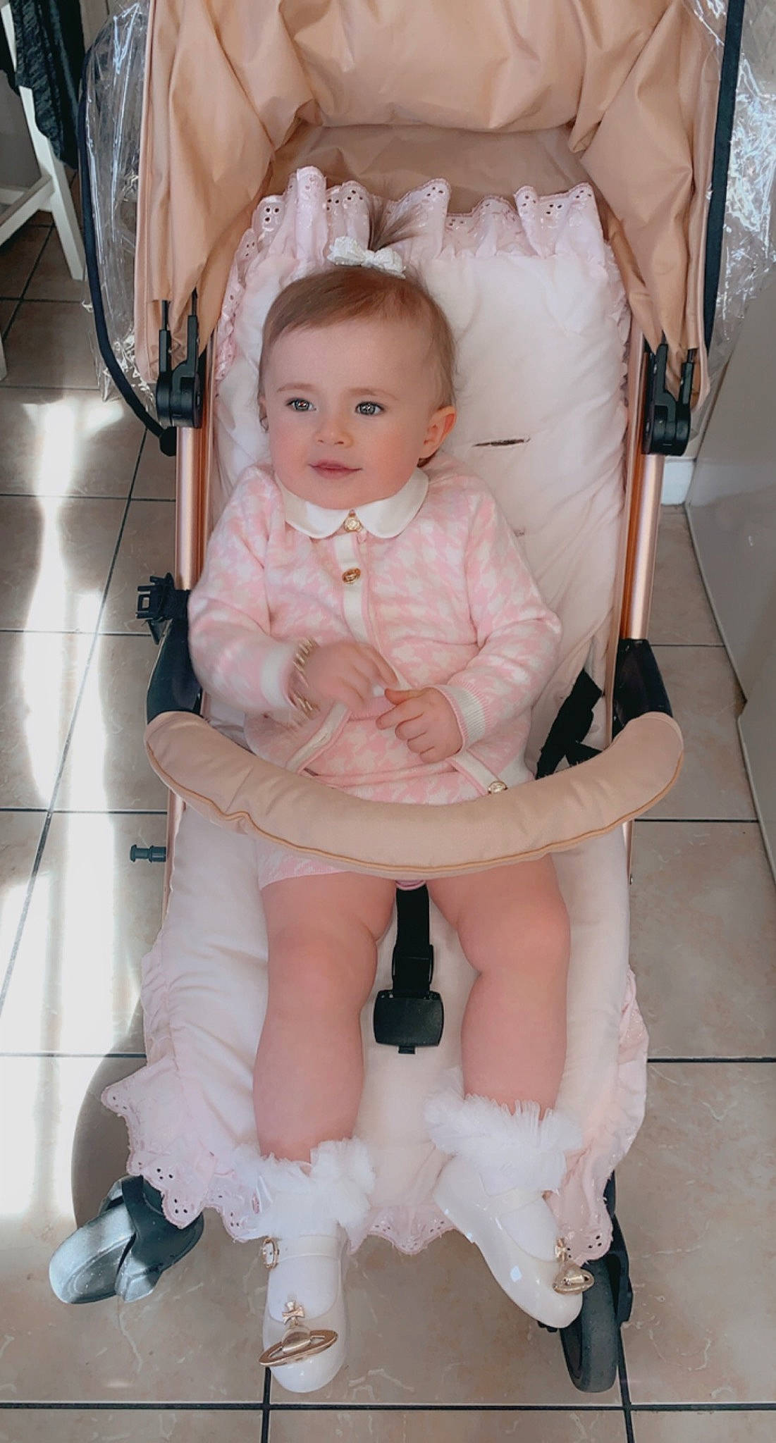 Darcie is registered to the contest to win money with this photo: baby, baby_toddler_clothing, cheek, comfort, dress, eye, flooring, hairstyle, happy, human_body, iris, joint, knee, person, pink, skin, sleeve, thigh, toddler, trunk