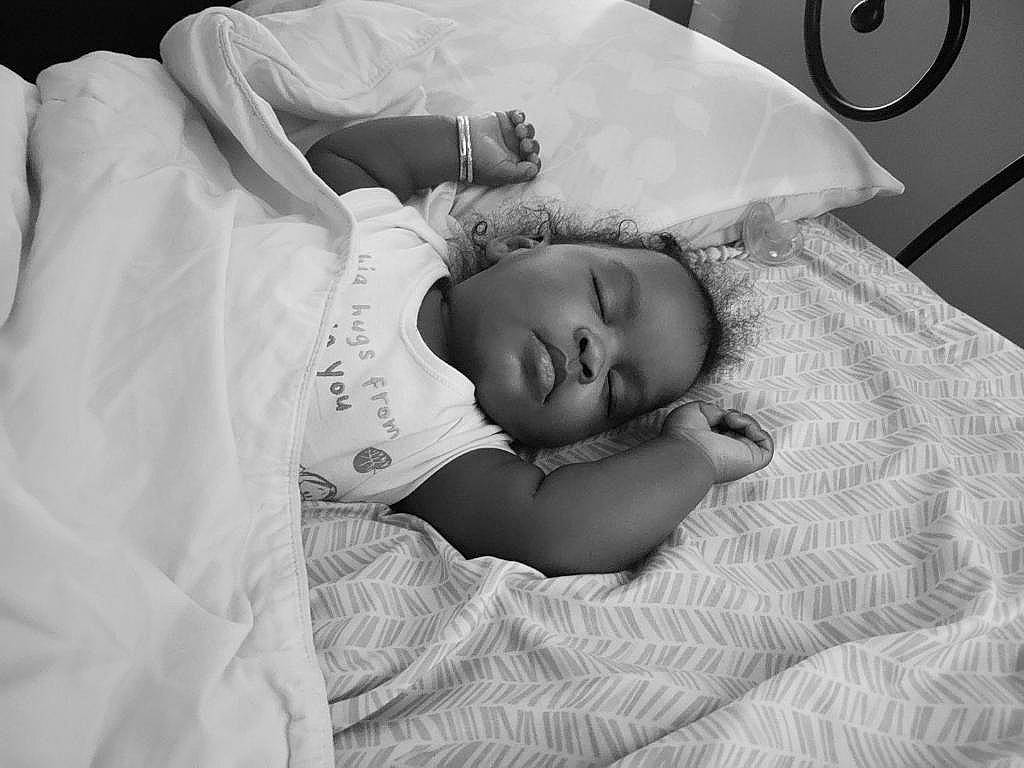 Nia joined the competition — help win amazing prizes! baby, baby_products, baby_sleeping, baby_toddler_clothing, bedding, bedtime, child, comfort, happy, linens, monochrome, monochrome_photography, nap, person, portrait_photography, room, skin, sleep, toddler