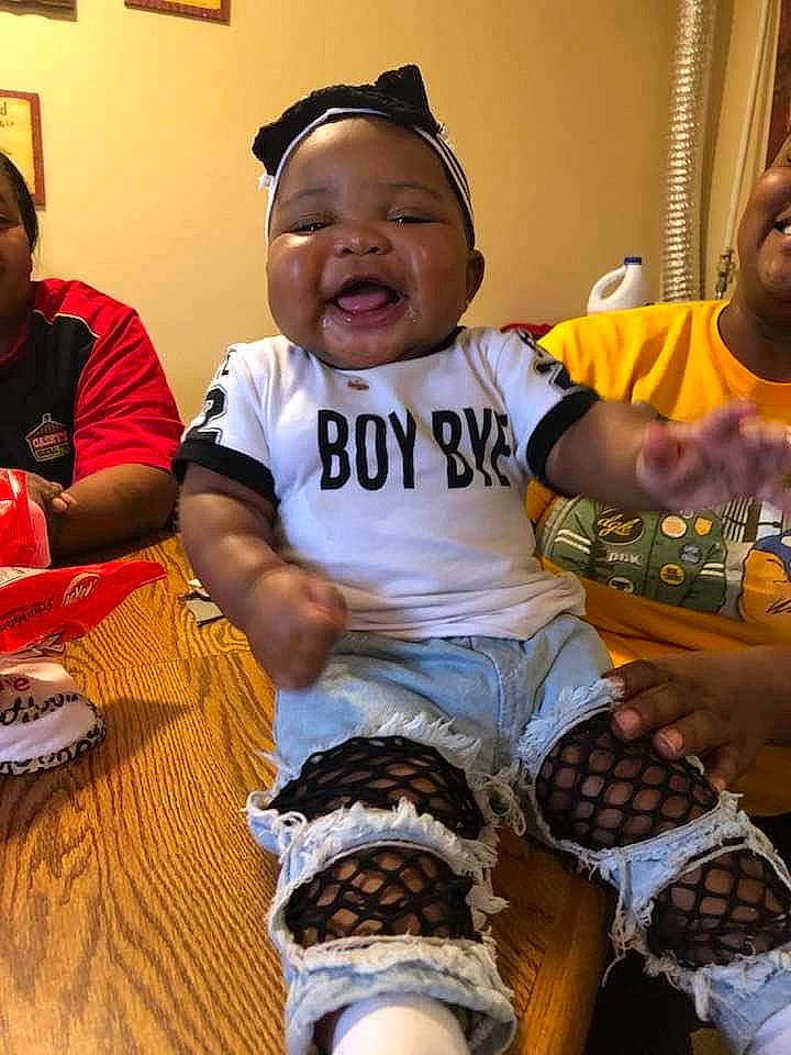 My'Ari joined the competition — help win amazing prizes! baby, child, cool, couch, event, finger, fun, happy, hat, leg, leisure, mammal, people, person, shorts, skin, smile, sock, t_shirt, thigh