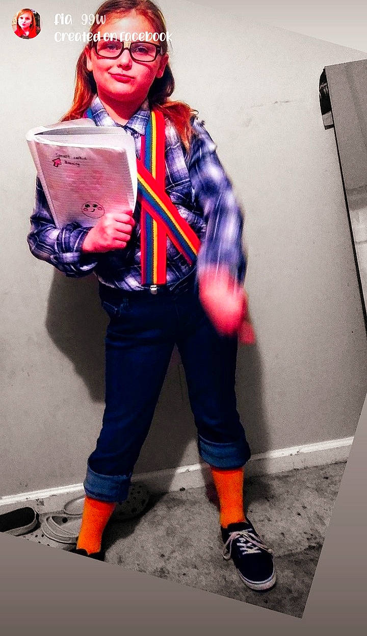 Sophia is registered to the contest to win money with this photo: bag, belt, electric_blue, eyewear, fashion_design, fictional_character, fun, headgear, human_leg, knee, outerwear, person, personal_protective_equipment, shoe, sneakers, sportswear, street_fashion, t_shirt, thigh, white