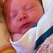 Juniper is registered to the contest to win money with this photo: baby, sleeping, newborn, blanket, soft, peaceful, face, wrapped, infant, closeup, cozy, child, skin, cute, resting, indoors, portrait, head, comfort, toddler