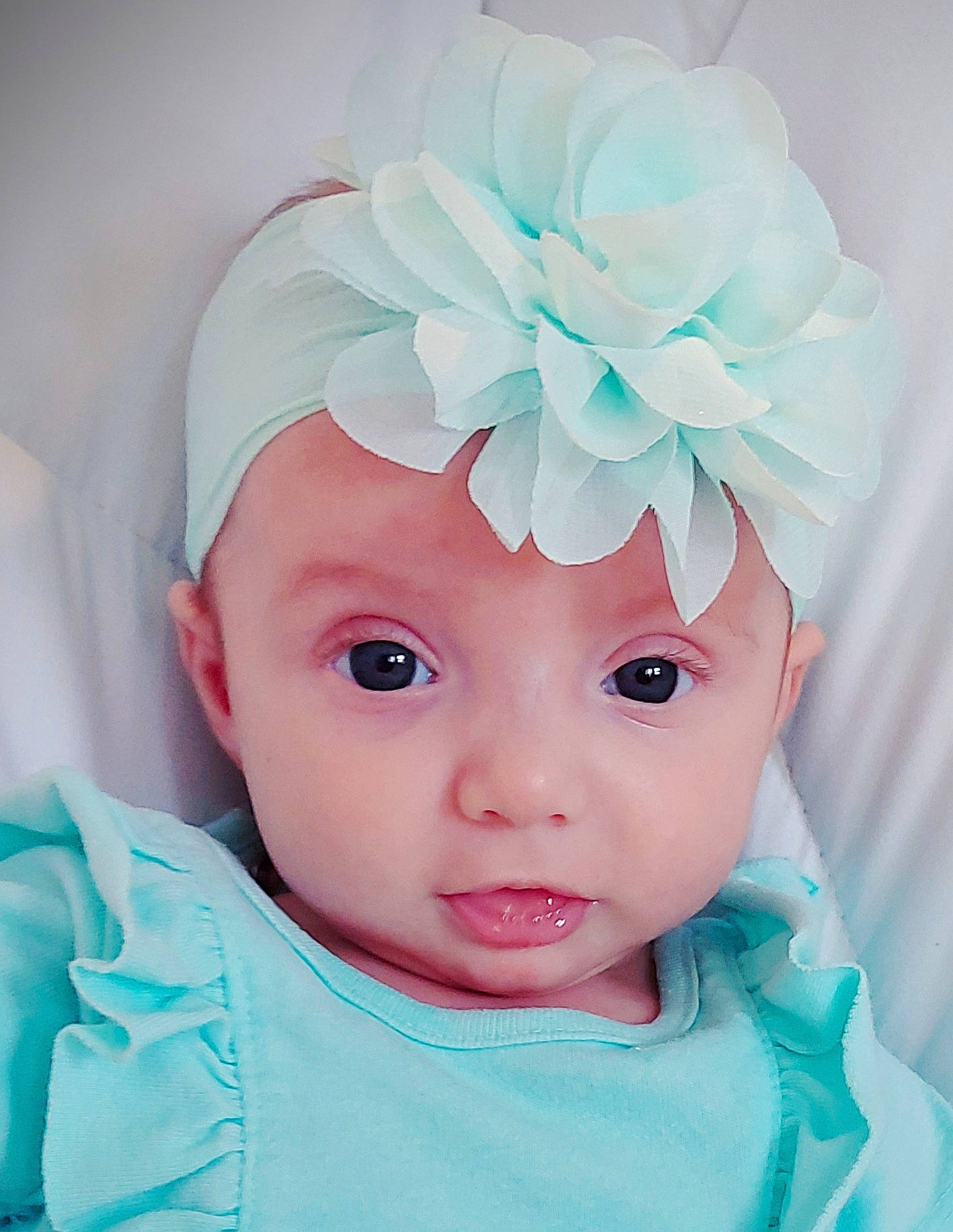 Avalee joined the competition — help win amazing prizes! baby, baby_products, baby_toddler_clothing, cap, child, costume_hat, eyelash, fashion_accessory, flower, hair_accessory, happy, head, headband, headgear, headpiece, headwear, iris, magenta, person, petal