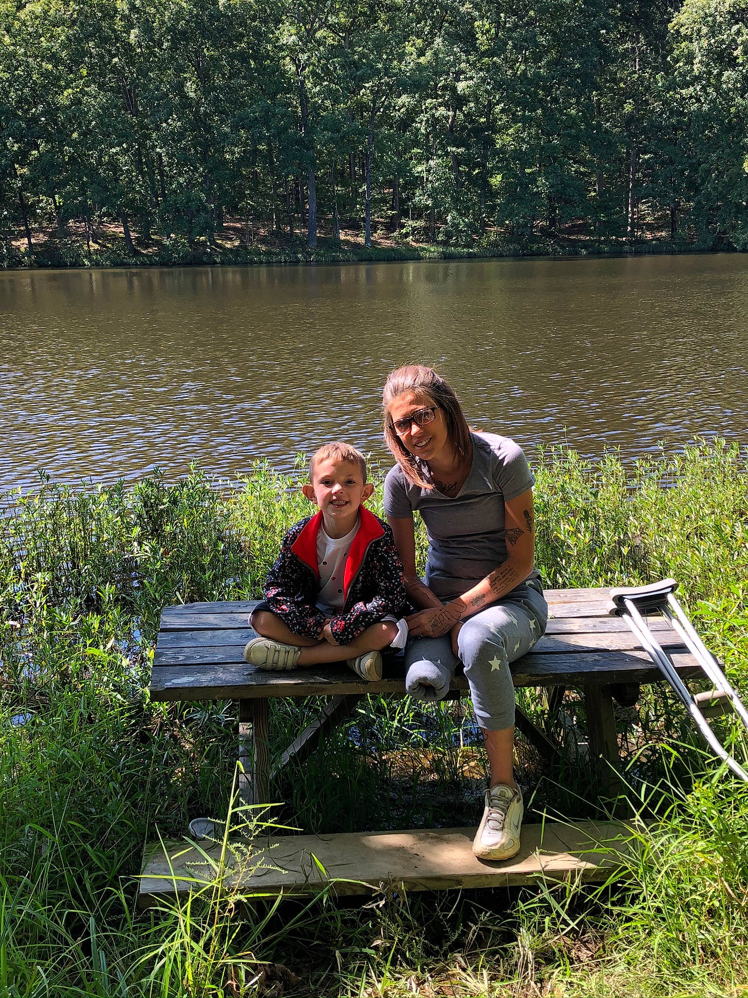 Stefan is registered to the contest to win money with this photo: bank, forest, grass, joy, lacustrine_plain, lake, landscape, leisure, natural_landscape, outdoor_recreation, people_in_nature, person, plant, plant_community, recreation, shorts, shrub, tree, vegetation, water