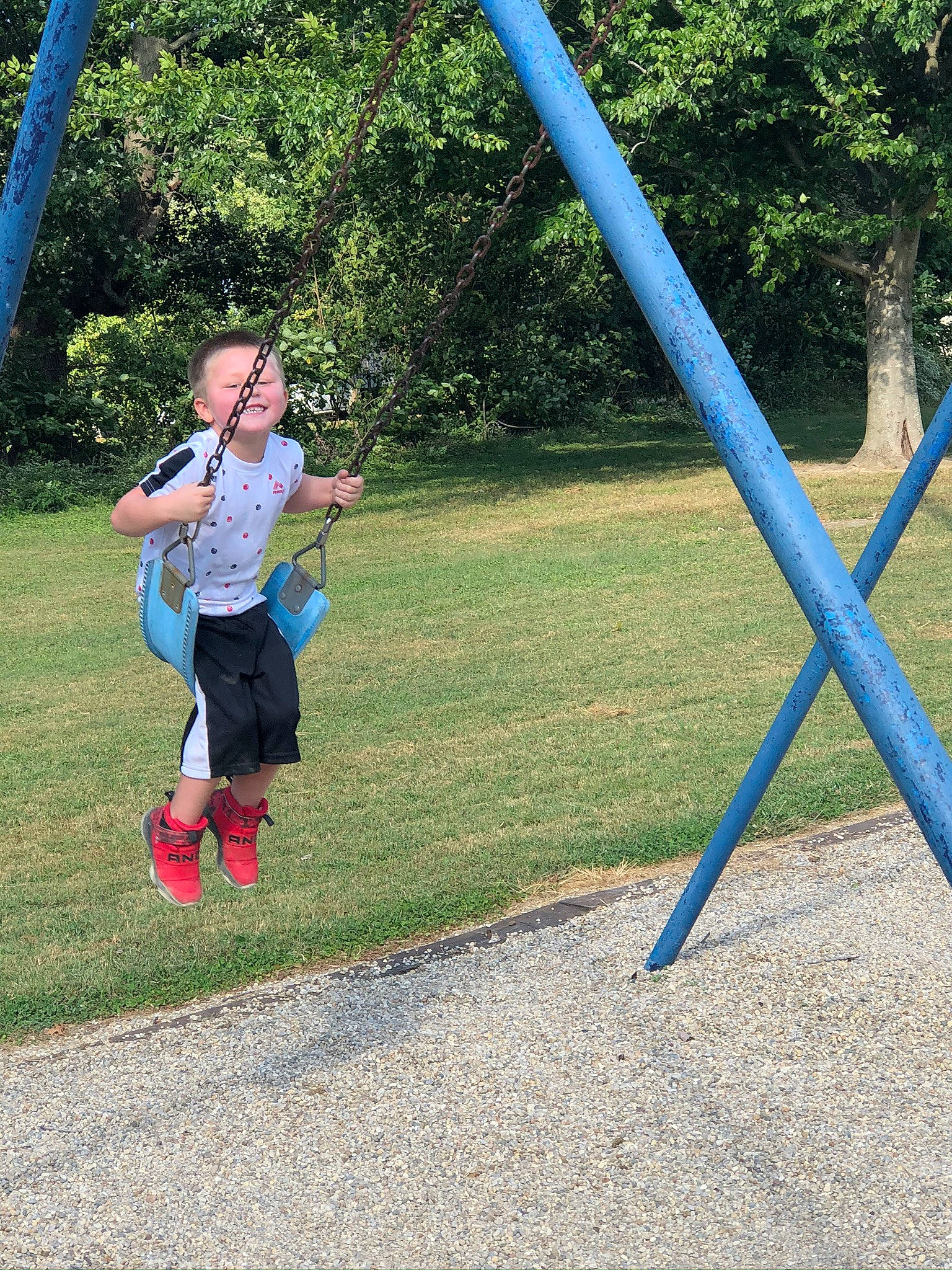 Nicolas joined the competition — help win amazing prizes! balance, chute, city, electric_blue, fun, grass, leisure, outdoor_play_equipment, outdoor_recreation, people_in_nature, person, physical_fitness, plant, playground, pole, recreation, shade, t_shirt, tree