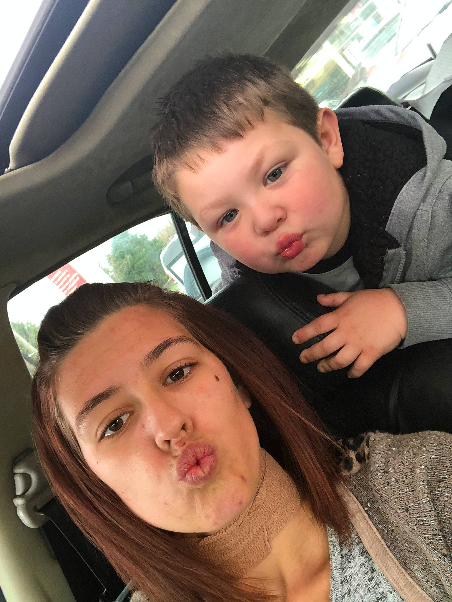 Bryson is registered to the contest to win money with this photo: automotive_design, chin, cool, eye, eyebrow, eyelash, facial_expression, flash_photography, forehead, fun, gesture, hairstyle, happy, interaction, jaw, lip, motor_vehicle, mouth, organ, person