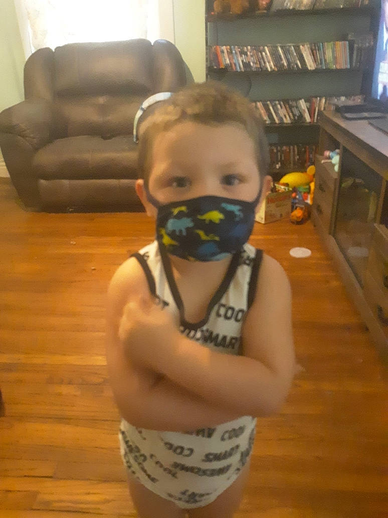 Bryson joined the competition — help win amazing prizes! arm, beard, bookcase, chin, eye, eyewear, floor, flooring, glasses, goggles, leg, mouth, neck, person, personal_protective_equipment, shelf, sunglasses, thigh, toddler, vision_care