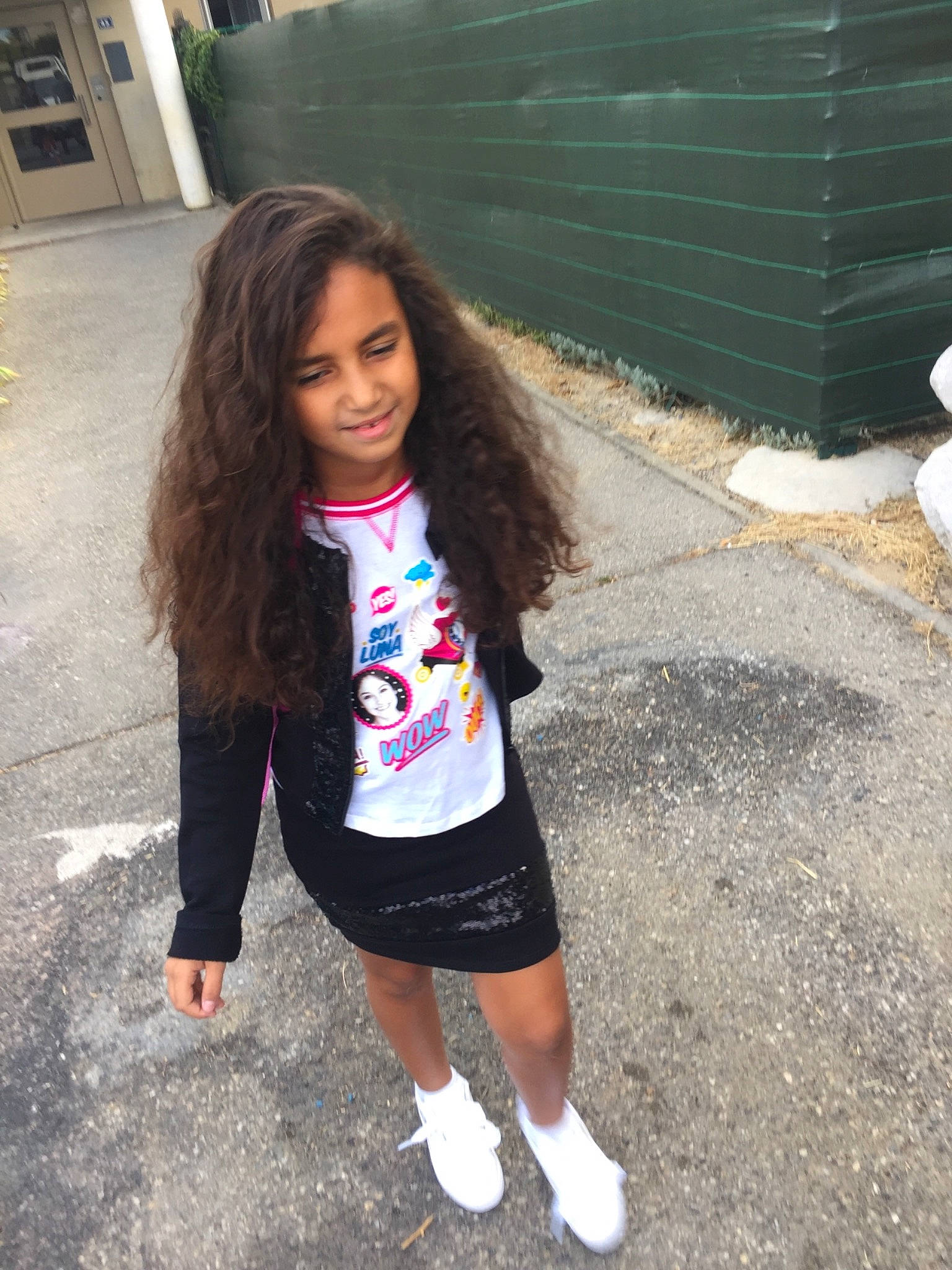 Cyrine participe au concours pour gagner de l'argent avec cette photo : child, clothing, cool, day, footwear, fun, girl, hair, hairstyle, joy, long_hair, outerwear, person, pink, product, shoe, shoulder, smile, snapshot, standing
